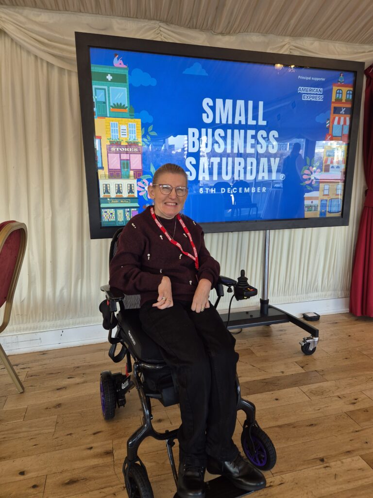 Person in wheelchair at event.