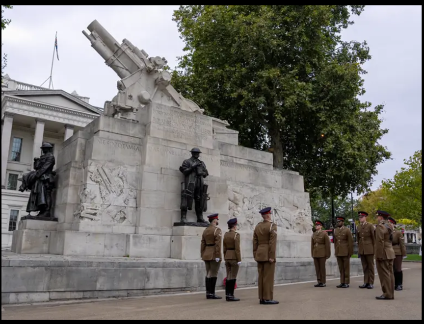 Soldiers at a war memorial site.
